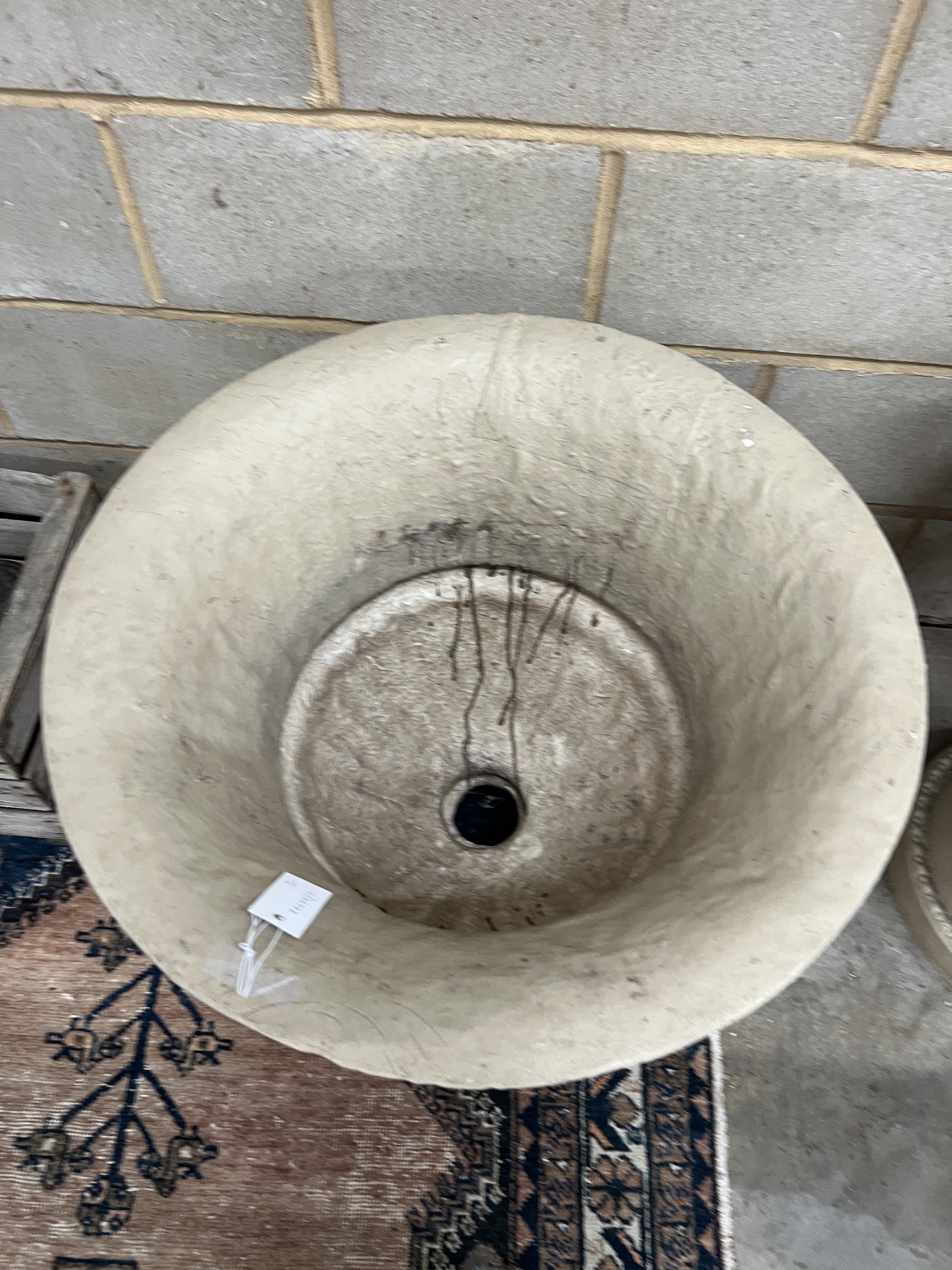 A pair of composition faux stone circular garden planters, diameter 62cm, height 60cm
